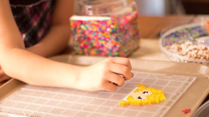 Child playing with game or puzzle.